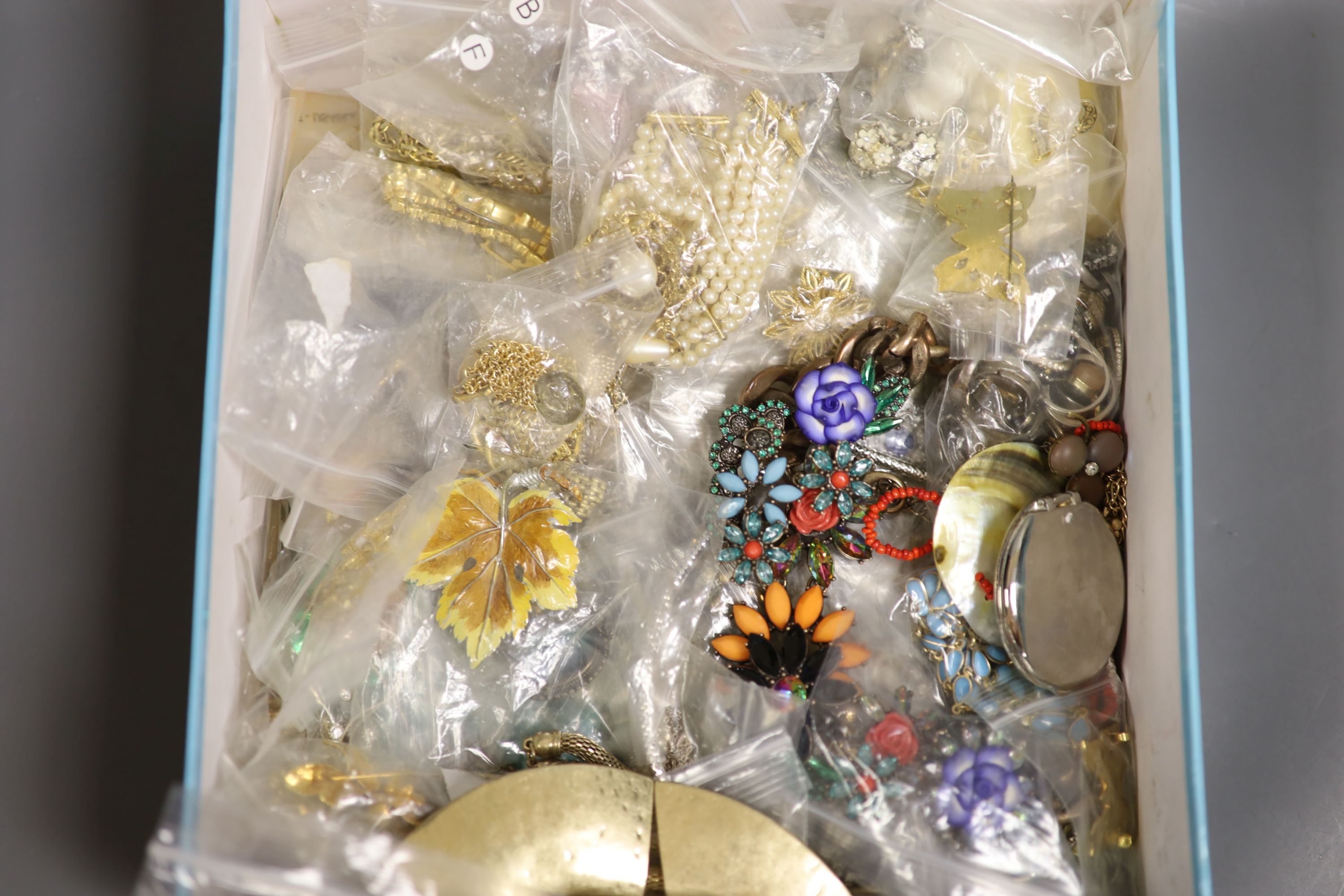 A box of assorted costume jewellery.